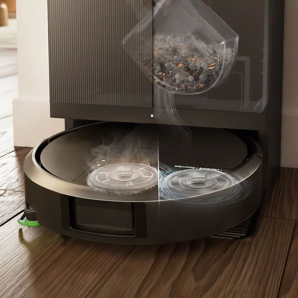 Roomba&reg; Plus 515 Combo Robot auto emptying debris while heat-washing then heat-drying mop pads.